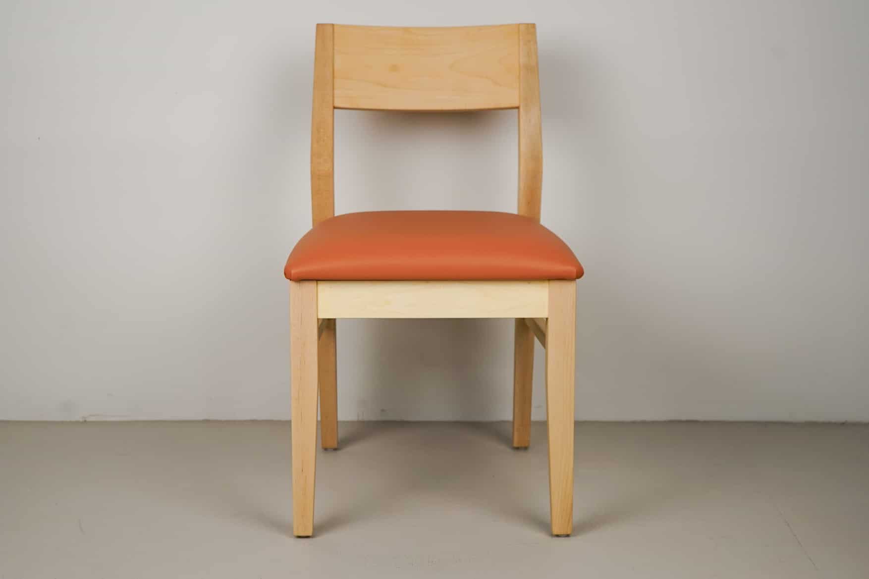 pumpkin faux leather seat on natural maple chair
