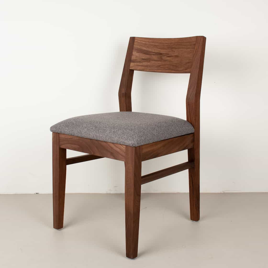 graphite faux leather seat on walnut chair
