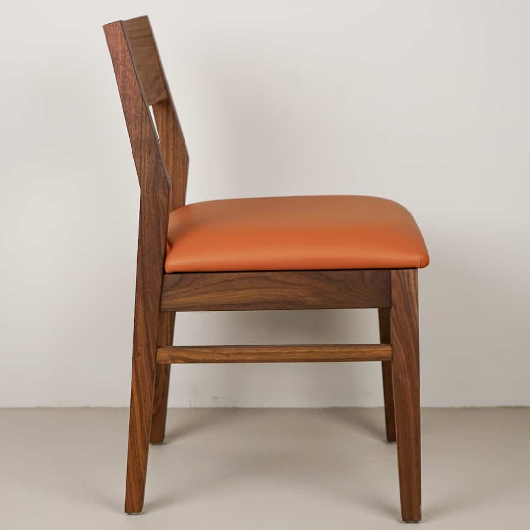pumpkin faux leather seat on walnut chair