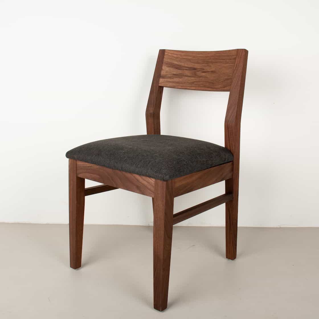 raven fabric seat on walnut chair