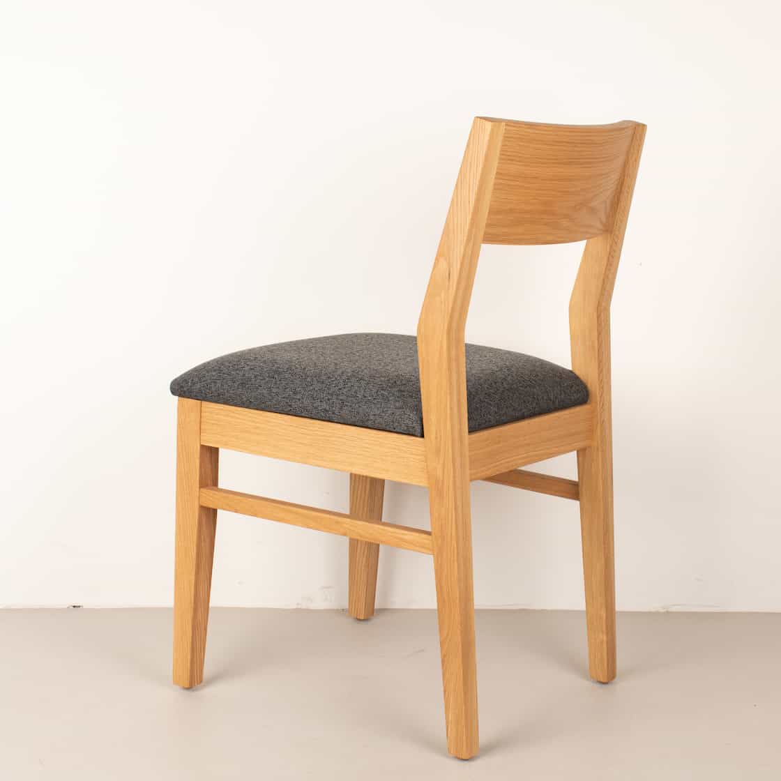 charcoal fabric seat on natural oak chair