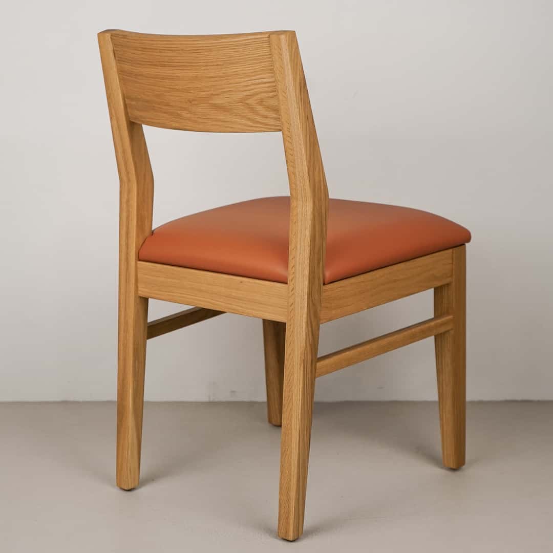 pumpkin faux leather seat on natural oak chair