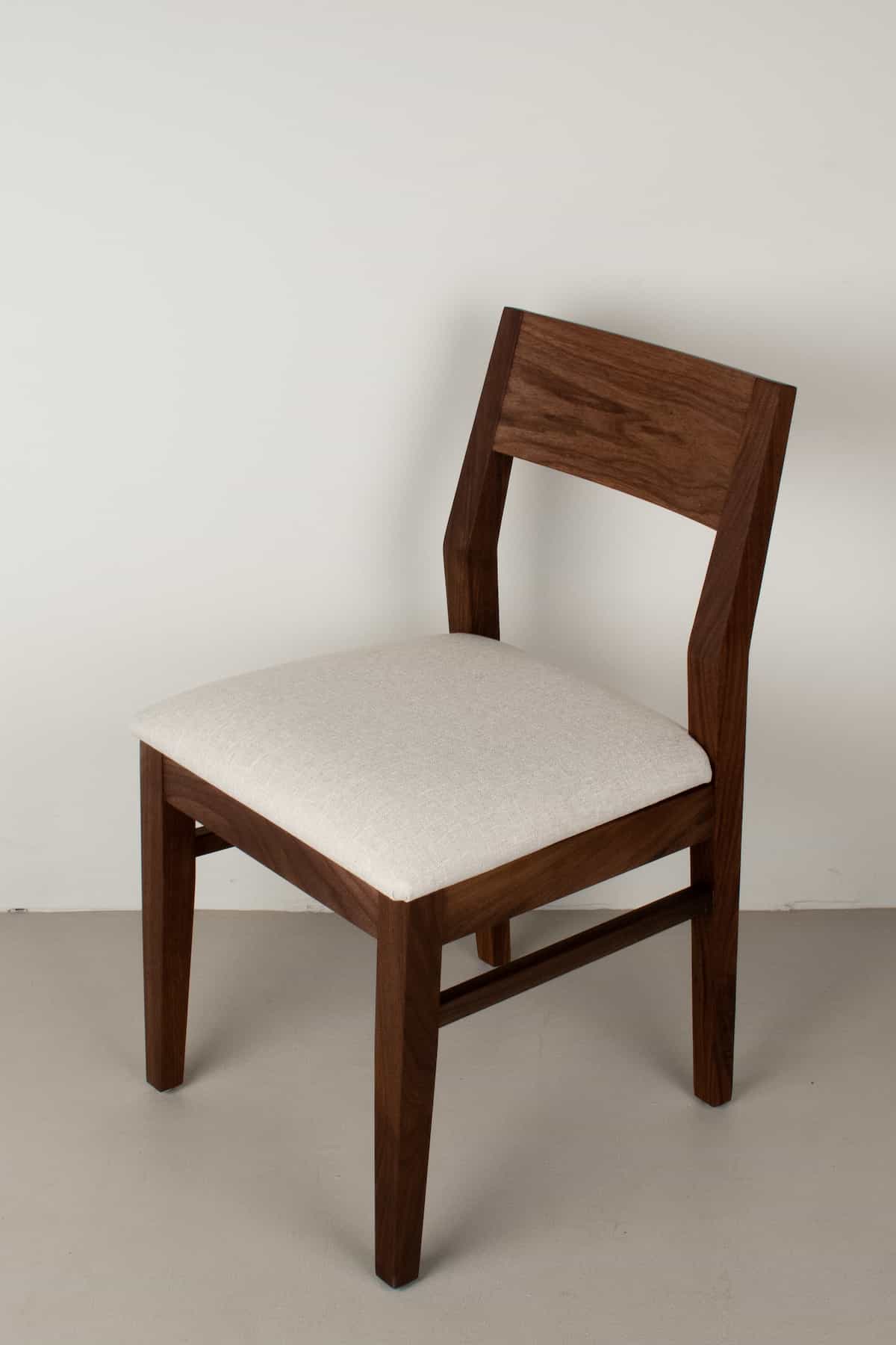 bone fabric seat on walnut chair