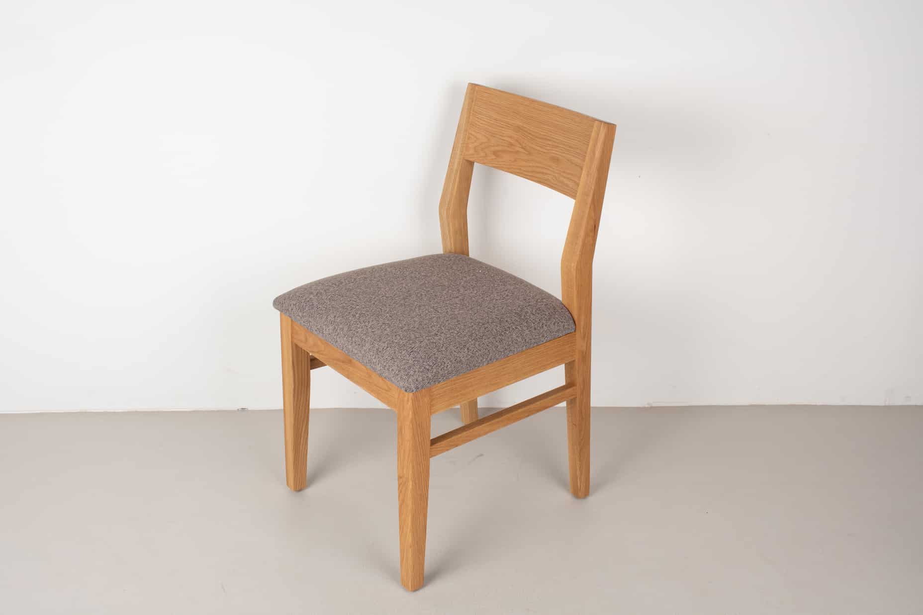 graphite faux leather seat on natural oak chair