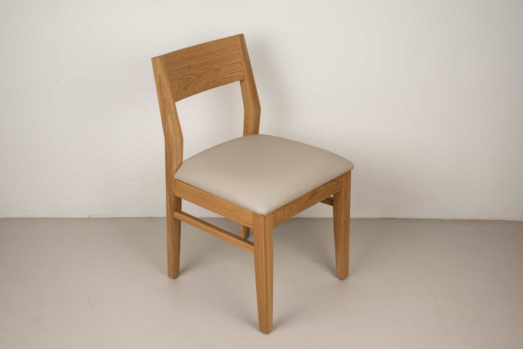 mushroom faux leather seat on natural oak chair