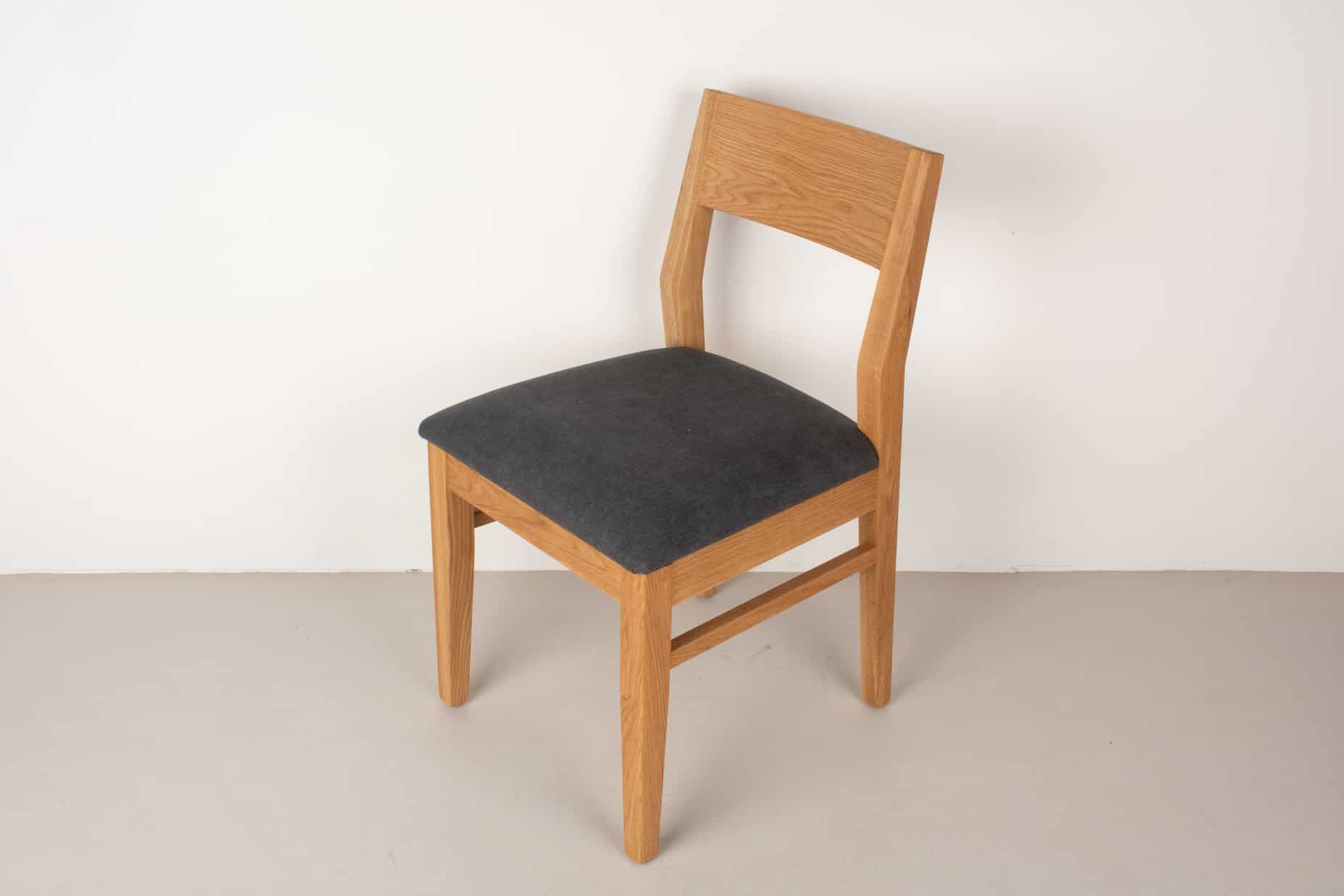 raven fabric seat on natural oak chair