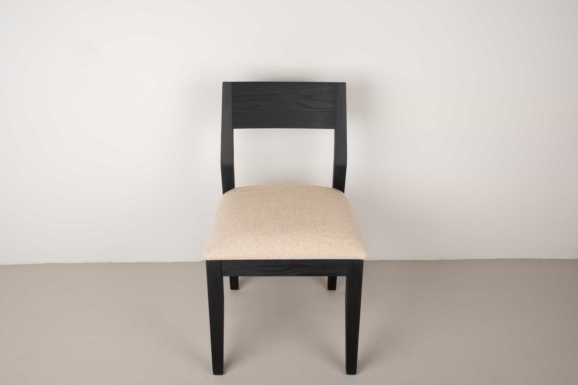 oak Aubrey chair in black with sand cushion