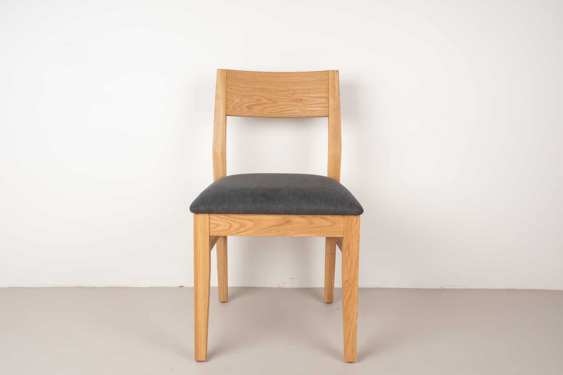 oak Aubrey chair in natural with raven cushion