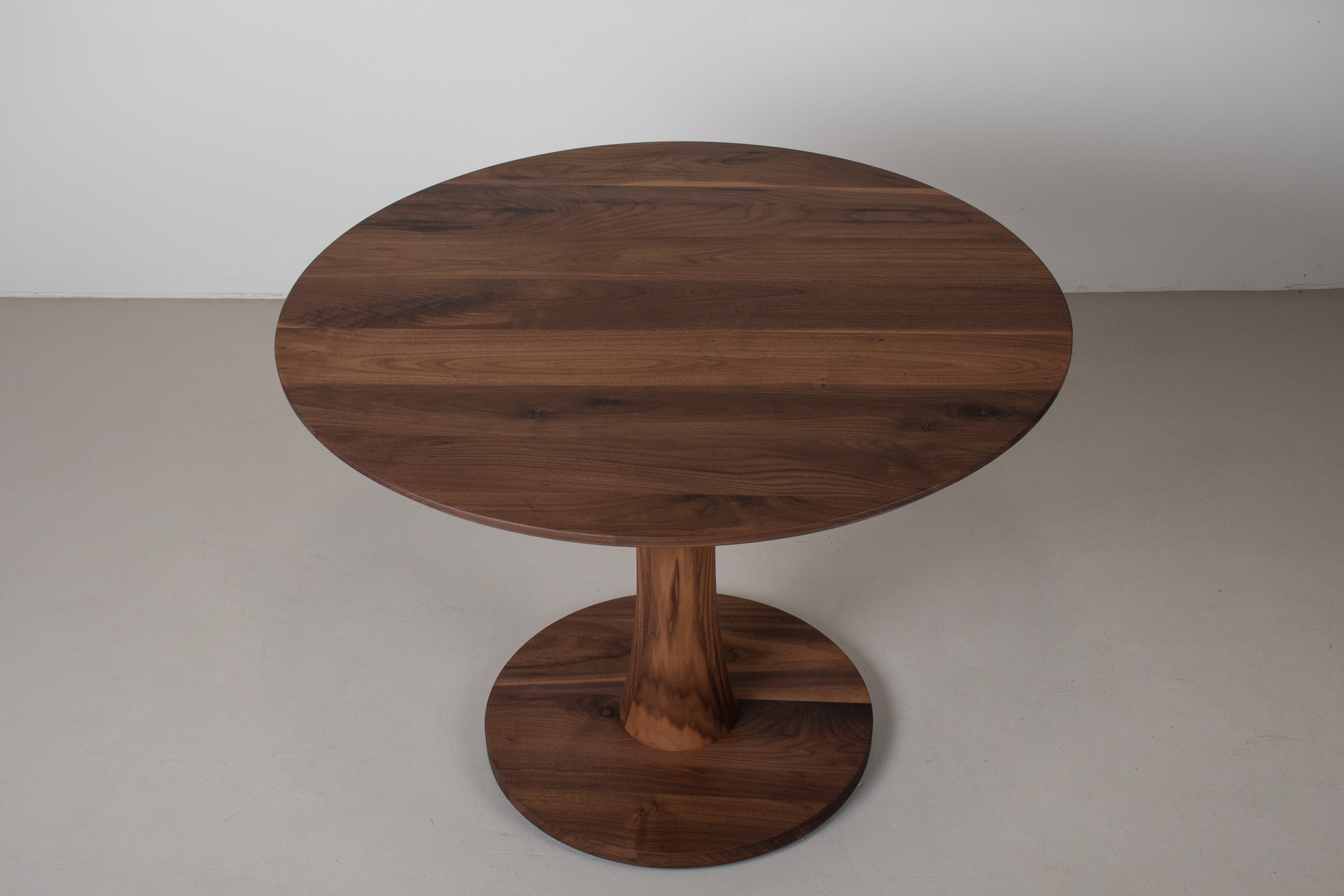 Custom Round Walnut table for YCC Design Interiors