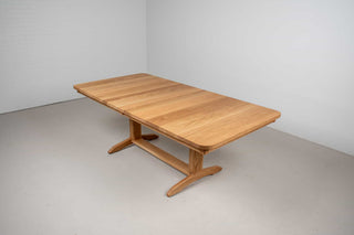 extendable oak dining table on traditional trestle base