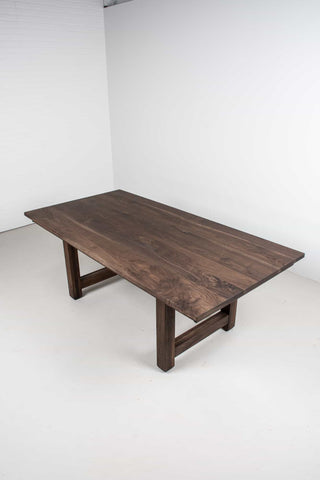 large extendable farmhouse table in blackened walnut