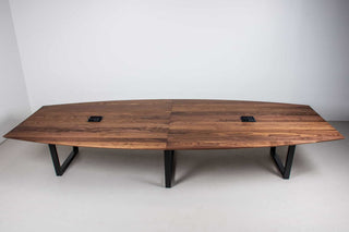 large squoval shaped walnut conference table 