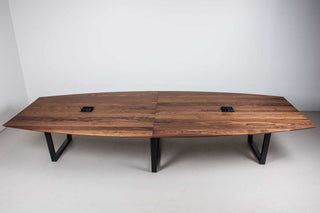 large squoval shaped walnut conference table