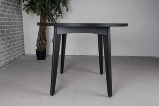 round oak extendable table on midcentury base