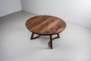 large round walnut expandable table on chesbro legs with hamelin edge