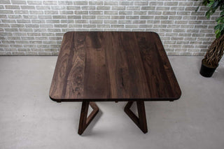 square extendable table in blackened walnut