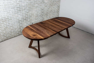 walnut racetrack oval extendable table on midcentury modern legs