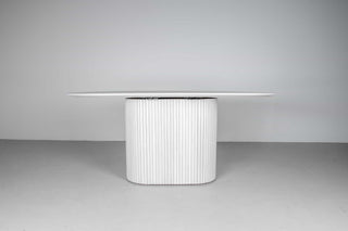 oval pedestal dining table made of ash wood finished in white