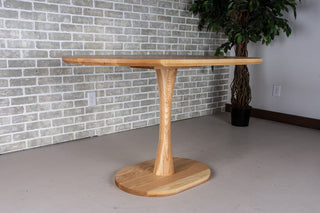 Jarvis Oval Pedestal Table in Natural Ash