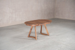 oval dining table made of solid wood on rounded wood legs