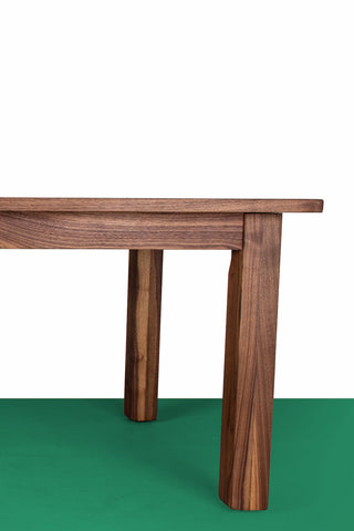 A Parsons Style Dining Table made from Walnut