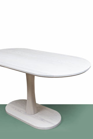 An Oval Pedestal Dining Table