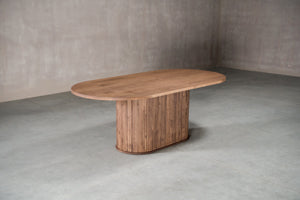 small wood pedestal table finished in white
