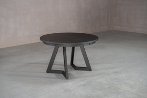 round oak dining table with extension leaves on pedestal base
