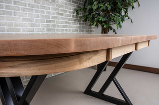 extendable oval dining table in rock maple on black steel legs