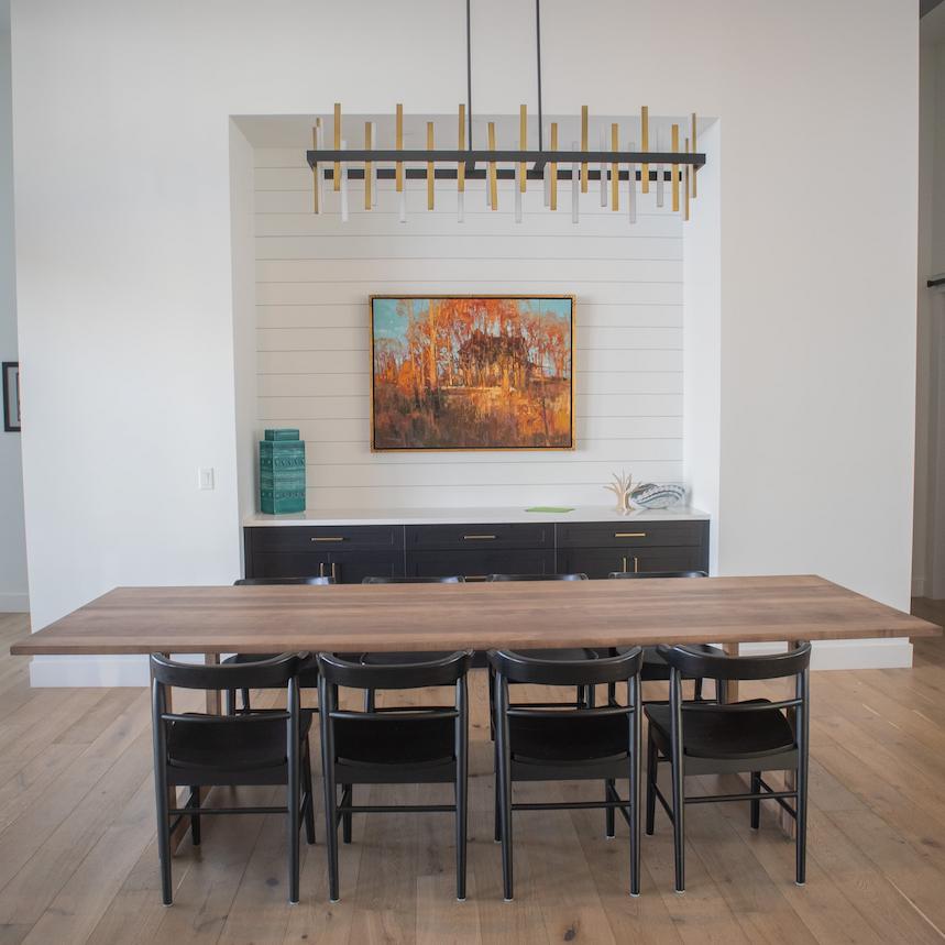 sleek modern table in a white dining room