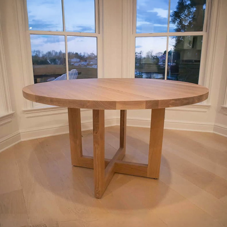 round oak table on cross base