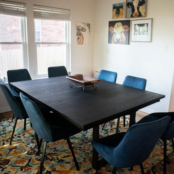 black square extendable table with blue chairs