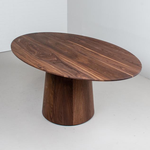 elliptical oval pedestal table in walnut
