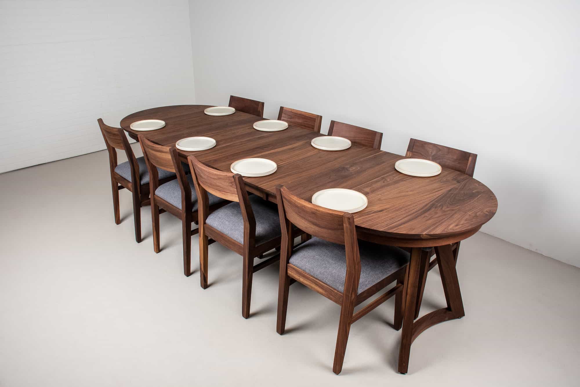 oval extendable table on chesbro legs shown with Aubrey chairs