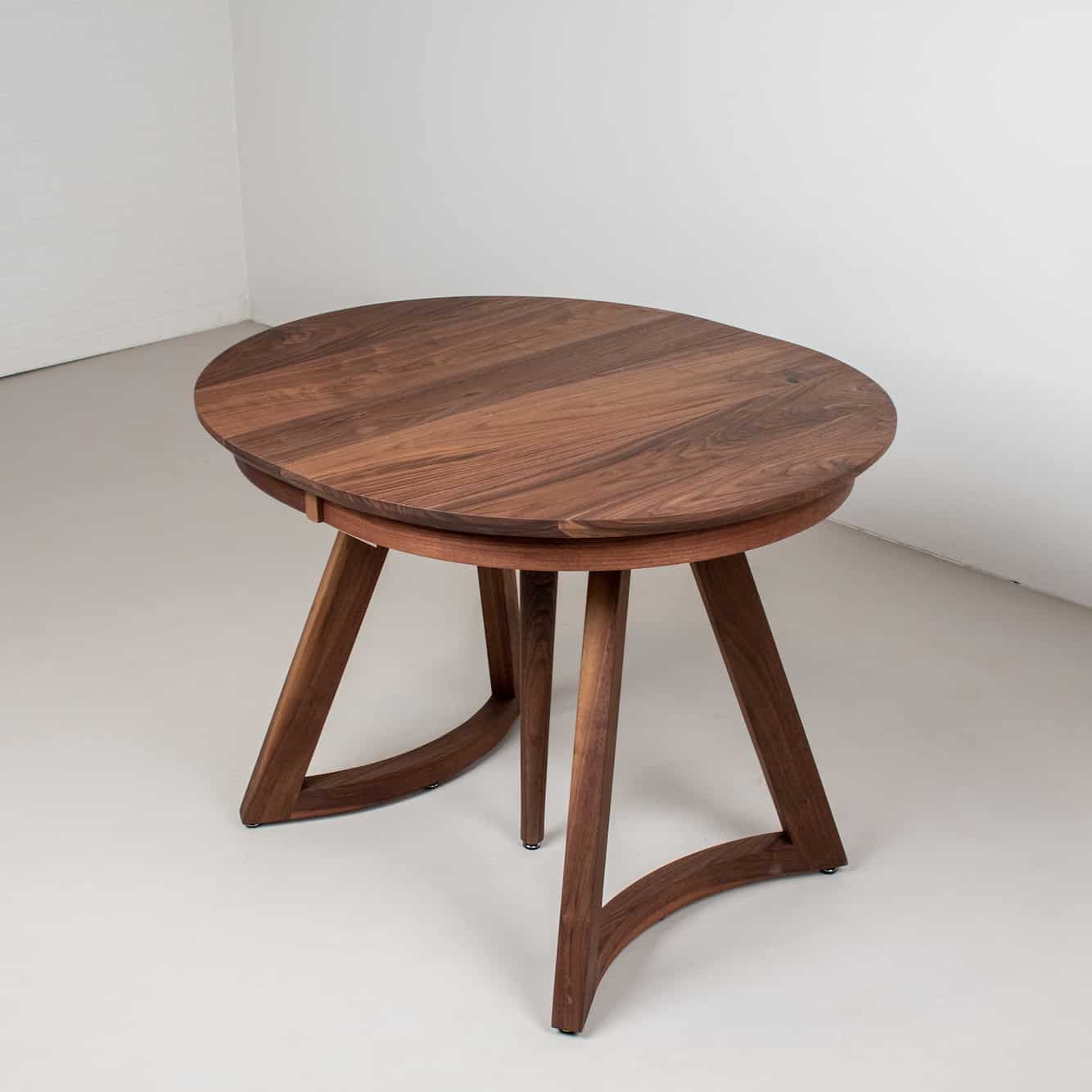 round walnut extending table with additional support leg