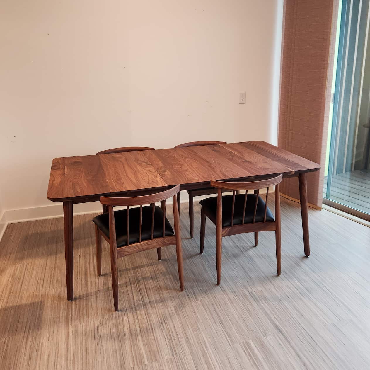 extended Walnut Pinette table in Pure D; shown with Eaton chairs