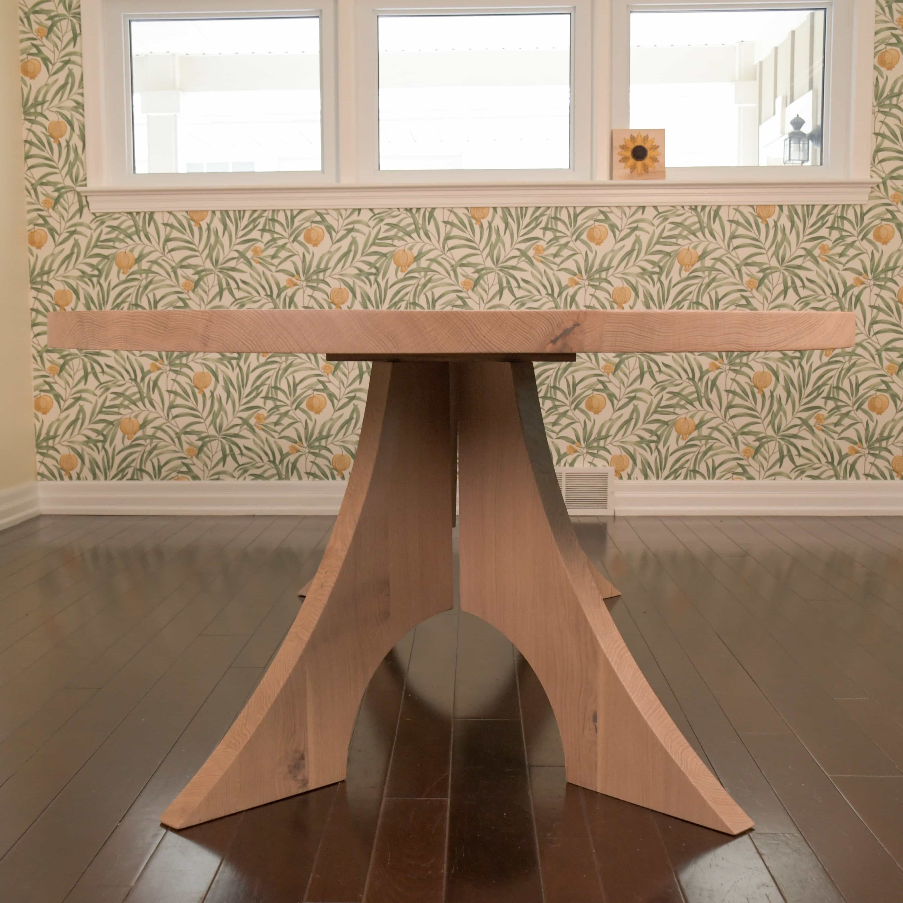 maple racetrack oval bookmatch table in a dining room
