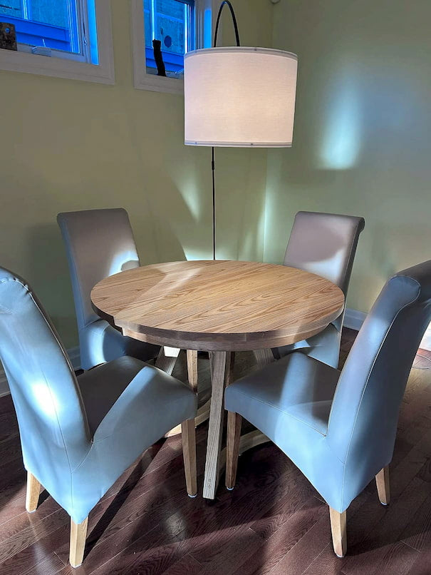 round ash extension table finished in Pure D