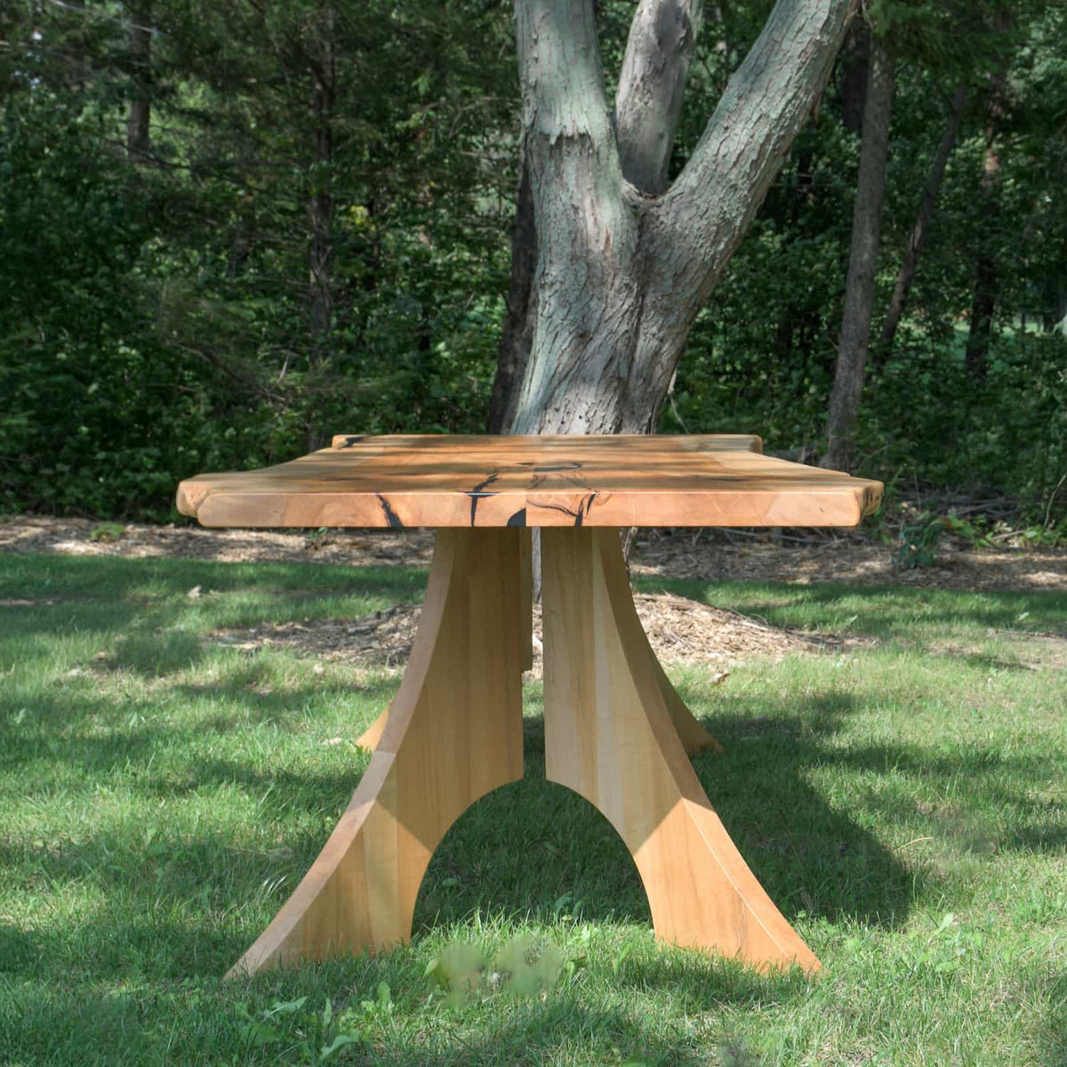 a live edge bookmatch Maple table 36