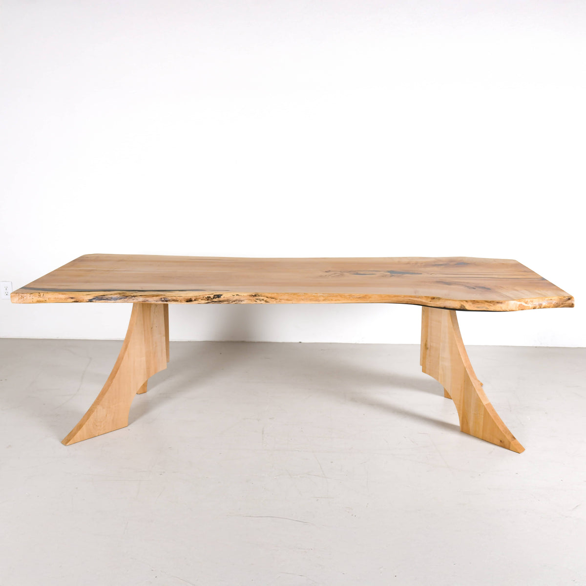a live edge bookmatch Maple table 36
