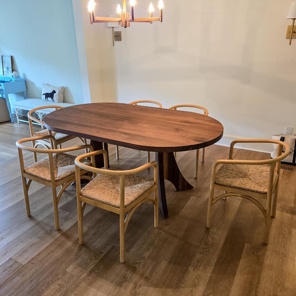 oval walnut table on Alta legs