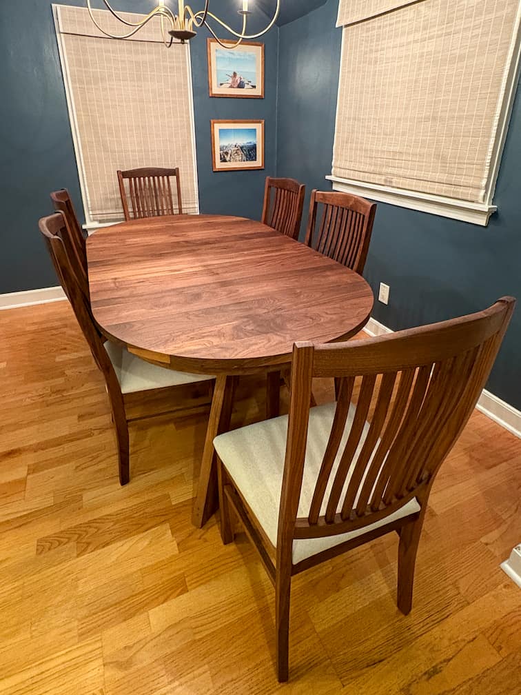 round walnut table with leaves finished in Pure D; shown with Betzner chairs