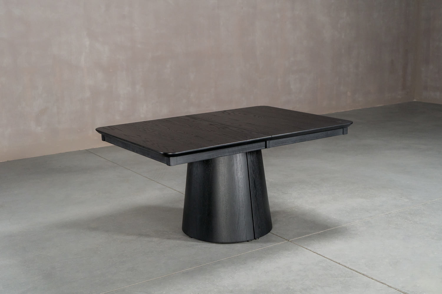 oak extending table on split cone base, all finished in black