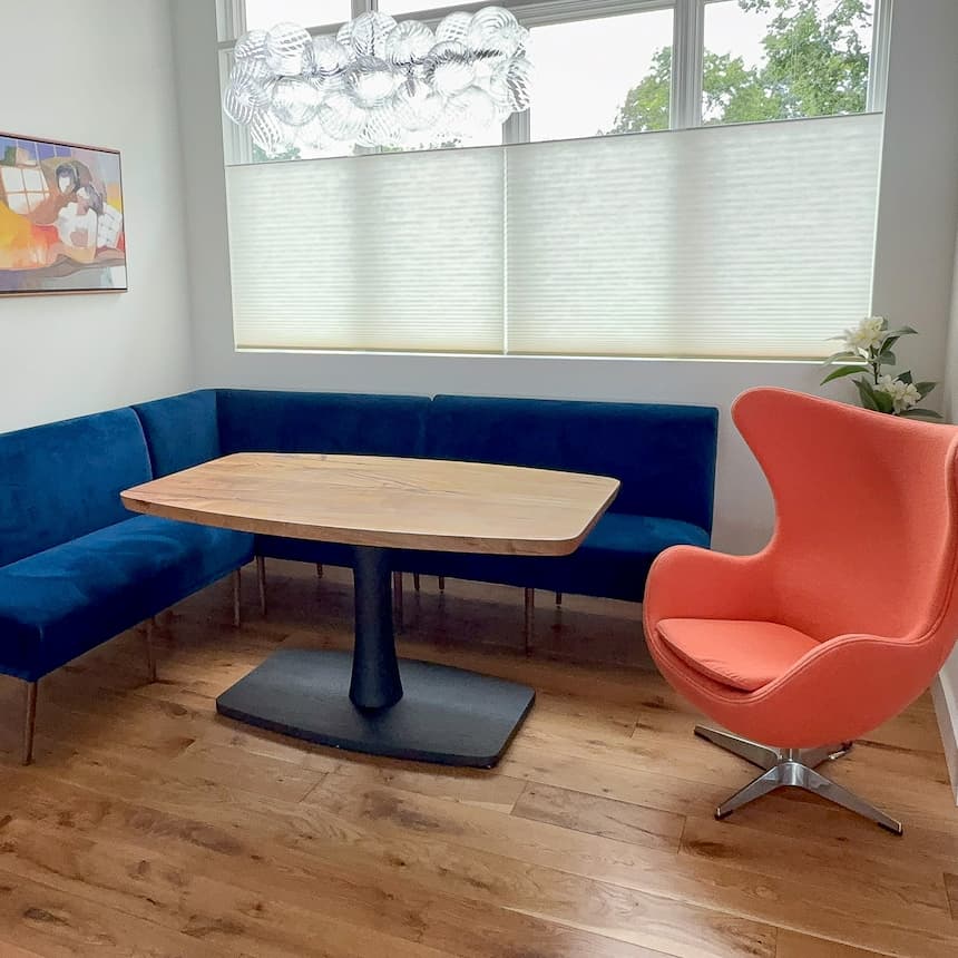 squoval shape pedestal table for a banquette