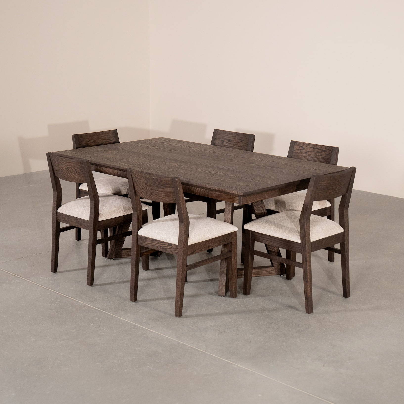 extendable Red Oak table 42” wide x  84” long, finished in Dark Roast W on Caldwell legs; shown with Aubrey chairs