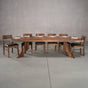 bookmatch Walnut table 40” wide x 108” long, finished in Pure D on Alta legs; shown with Walnut Aubrey chairs