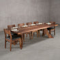 bookmatch Walnut table 40” wide x 108” long, finished in Pure D on Alta legs; shown with Walnut Aubrey chairs