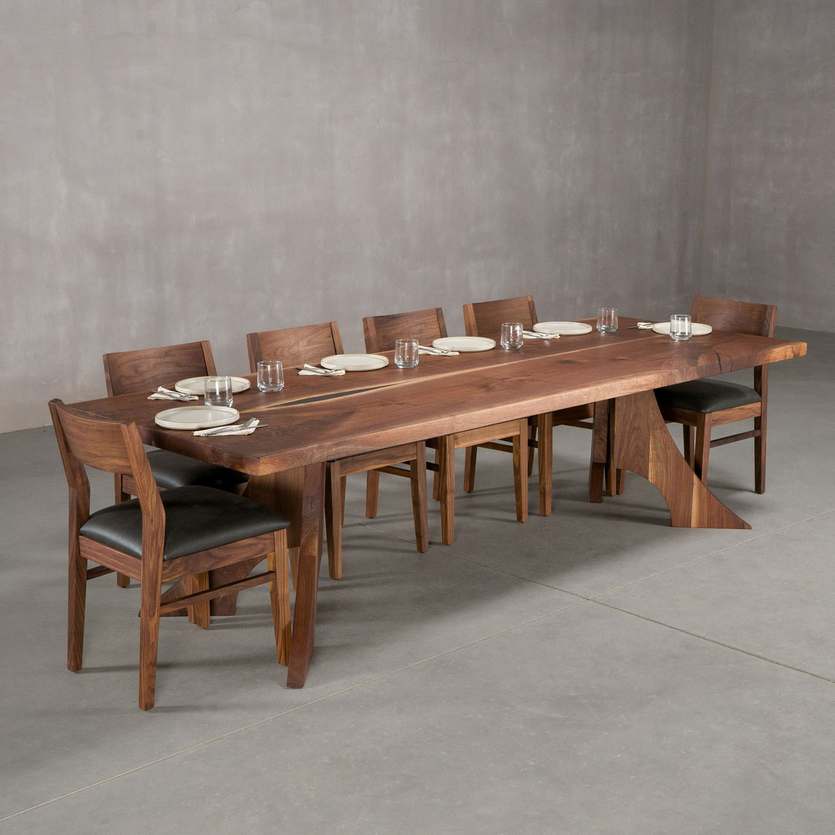 bookmatch Walnut table 40” wide x 108” long, finished in Pure D on Alta legs; shown with Walnut Aubrey chairs