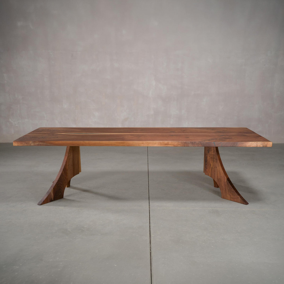 bookmatch Walnut table 40” wide x 108” long, finished in Pure D on Alta legs