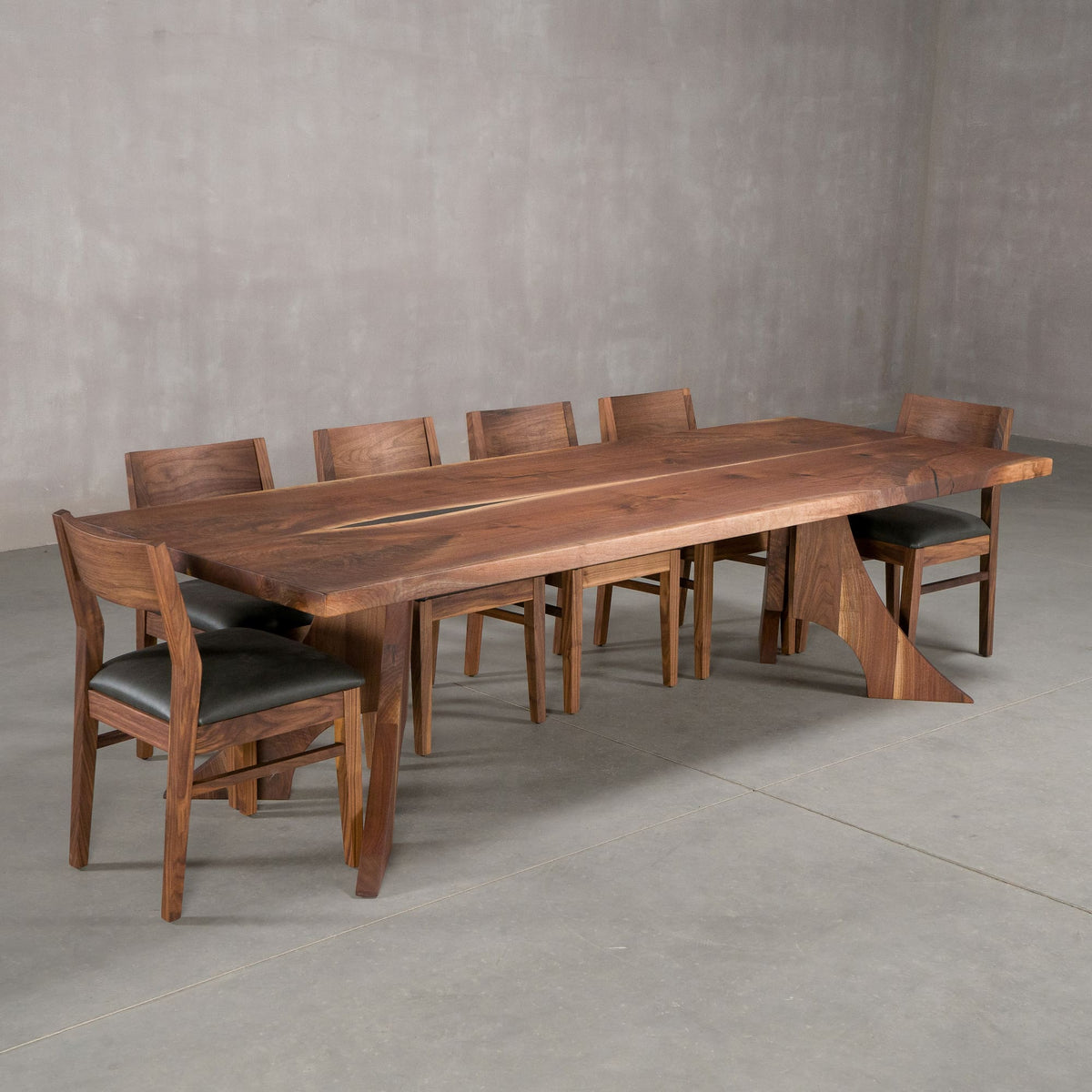 bookmatch Walnut table 40” wide x 108” long, finished in Pure D on Alta legs; shown with Walnut Aubrey chairs